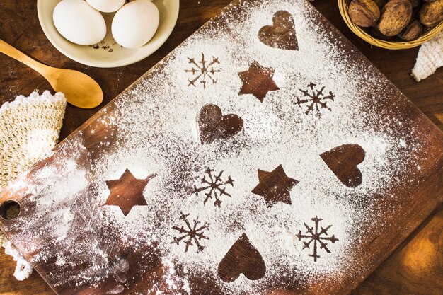 Shapes in flour near cooking ingredients