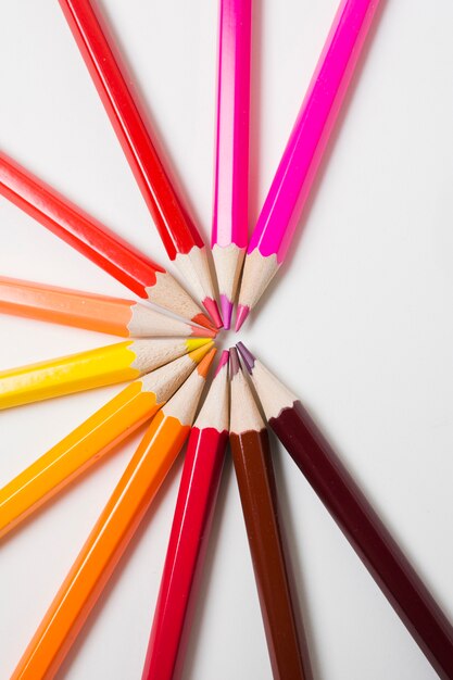 Sharpened colored pencils on white background
