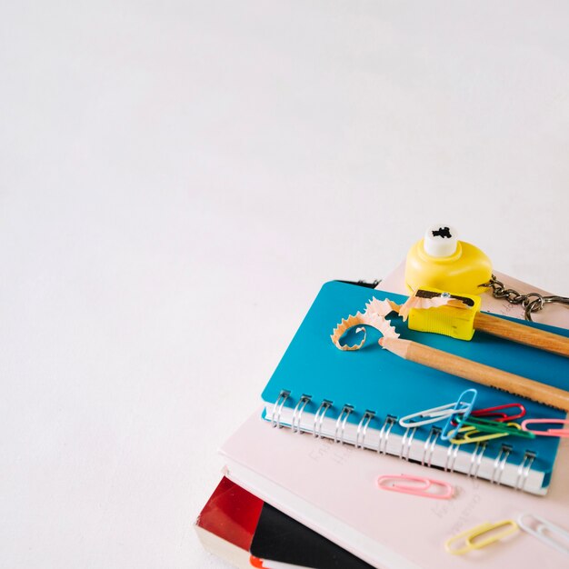 Sharpened pencils and sharpener on notebook