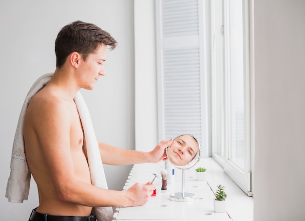 Shaving concept with attractive man