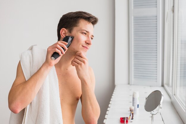 Shaving concept with attractive man