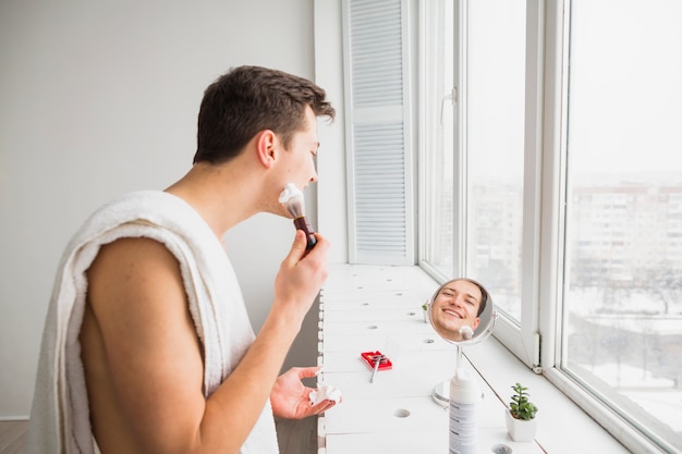 Shaving concept with attractive man