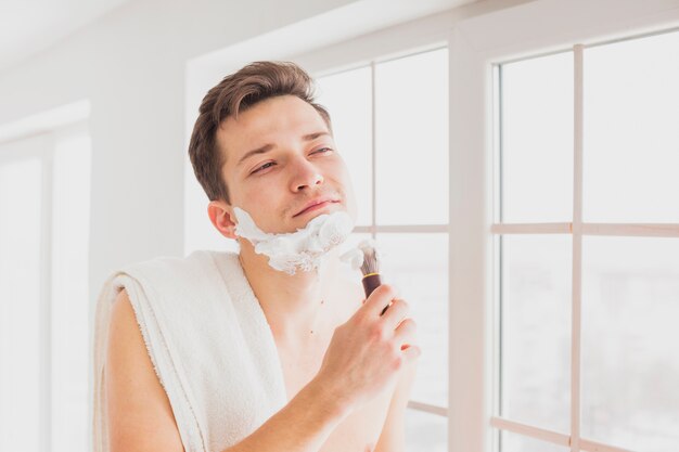 Shaving concept with attractive man