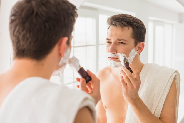 Shaving concept with attractive man