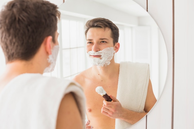 Shaving concept with attractive man