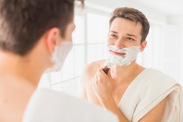Shaving concept with attractive man