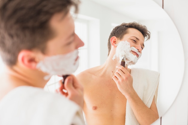 Shaving concept with attractive man