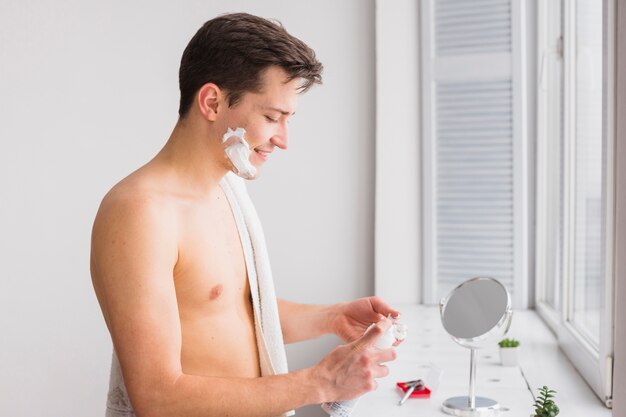 Shaving concept with attractive man