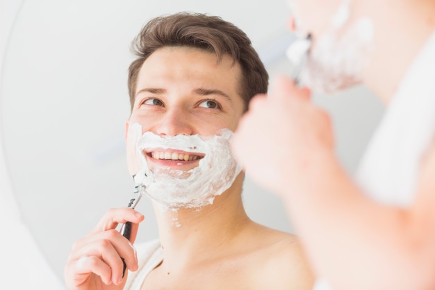 Free photo shaving concept with attractive young man