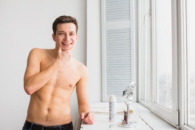 Free photo shaving concept with attractive young man