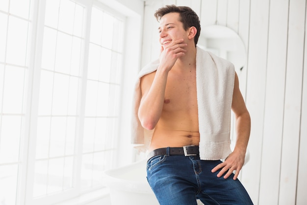 Shaving concept with attractive young man