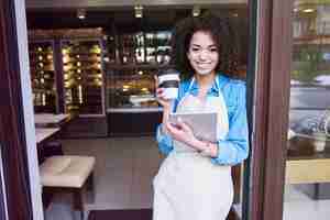 Free photo she is proud for her small coffee shop