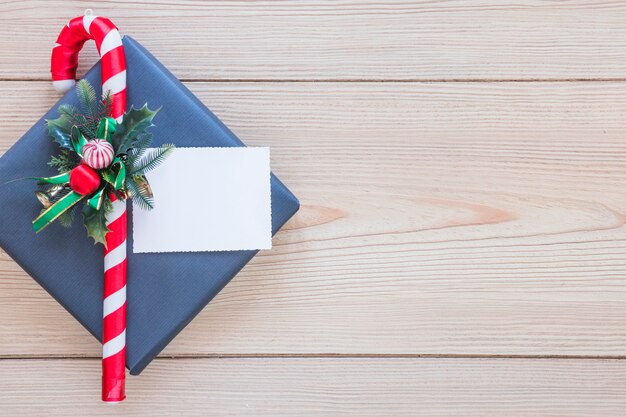 Sheet and decorative cane on present box 