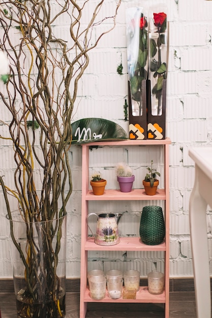 Shelf with pots and flowers