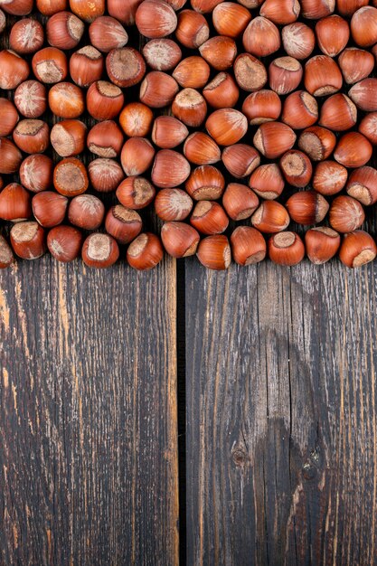 Shelled hazelnuts high angle view on a dark wooden table