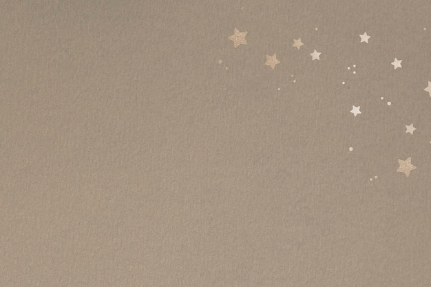 Shimmering gold stars on a beige background