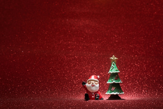 Shiny background with santa claus and a christmas tree