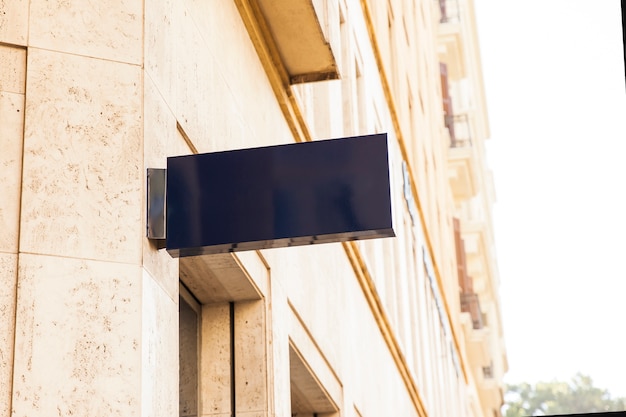 Shiny black sign on wall