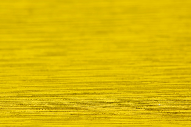 光沢のあるゴールドの織り目加工紙の背景