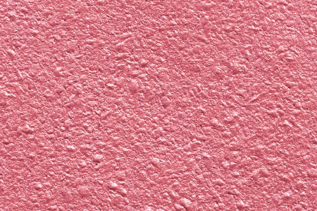 光沢のあるピンクの織り目加工の紙の背景