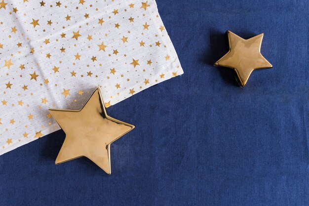 Shiny stars with napkin on table 