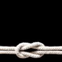 Free photo ship white ropes knot isolated on black background