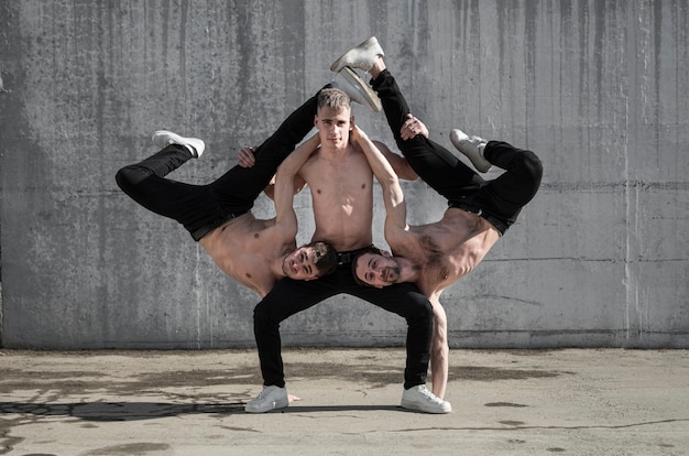 Free photo shirtless hip hop artists posing together