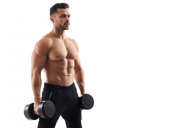 Shirtless male bodybuilder holding dumbbells.