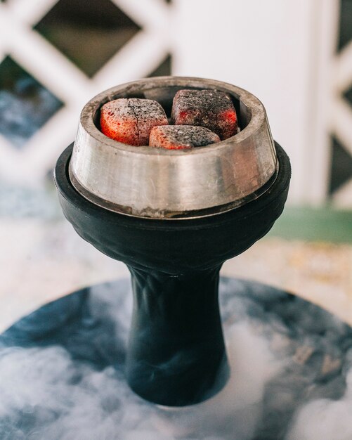 Shisha kiln with fire and steam.