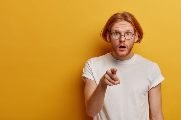 Shocked embarrassed bearded man with ginger hair and beard