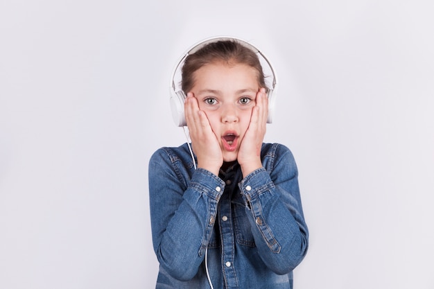 Shocked girl listening to music