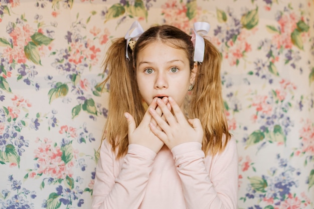 Shocked girl looking at camera