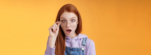 Free photo shocked impressed redhead coworker hearing last intimate rumors drop jaw staring full disbelief