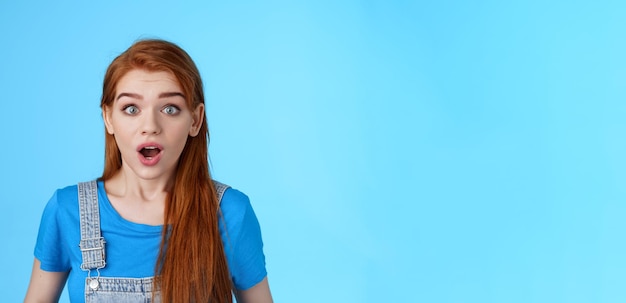 Free photo shocked redhead girl react omg shook drop jaw speechless stare impressed gasping amazed hear surpris