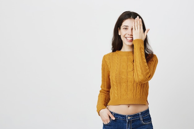 Shocked and surprised girl gasping, checking sight at opticians