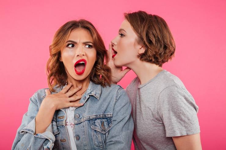 Free Photo shocked two women friends gossiping.