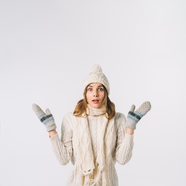 Shocked woman in warm clothes