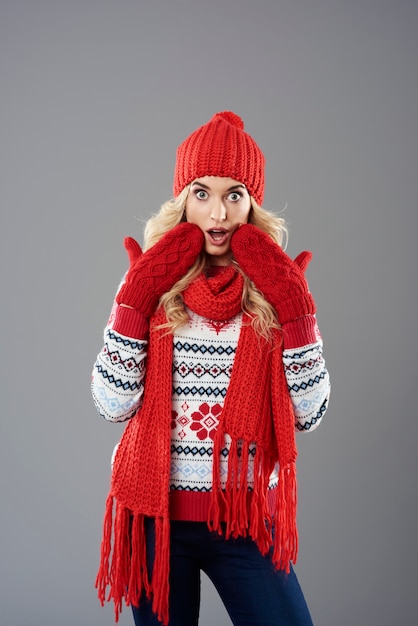 Free photo shocked woman wearing set of winter clothing