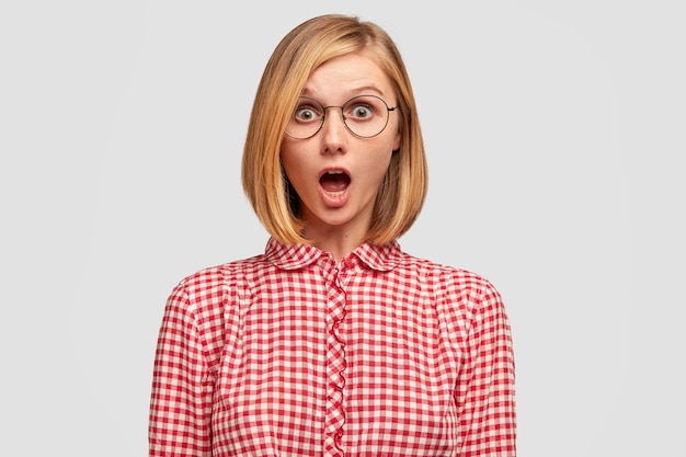 Shocked young European woman with light short hair