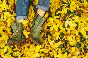 Free photo shoes in yellow autumn leaves