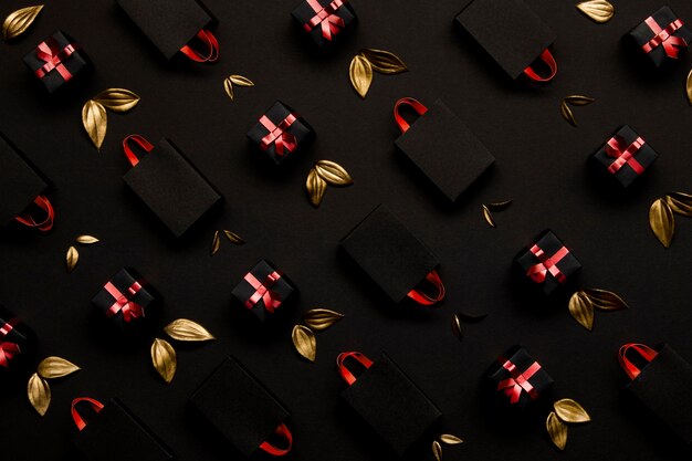 Shopping bags and golden leaves background