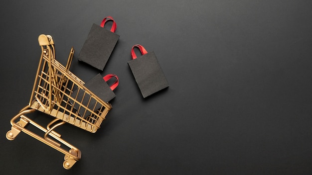 Shopping bags in golden shopping cart