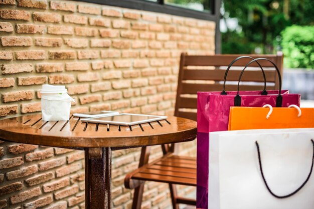 Shopping bags on an outdoor cafe 