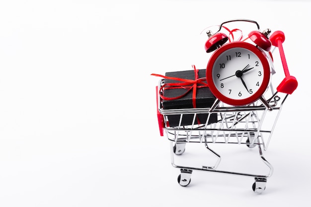 Shopping cart with gift and alarm clock