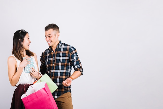 Shopping concept with couple and space on right