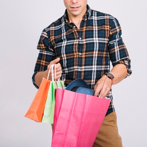 Shopping concept with man holding bags