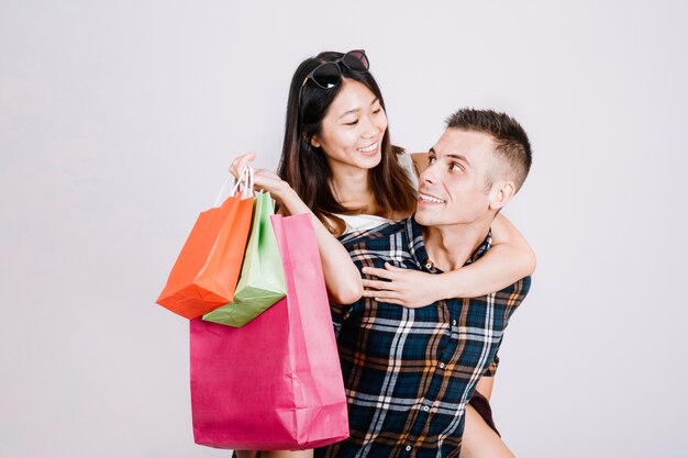 Shopping concept with young couple looking at each other