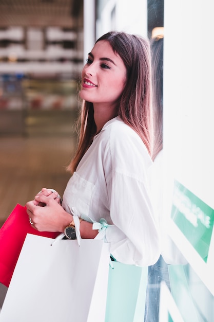 Free photo shopping girl carrying bags