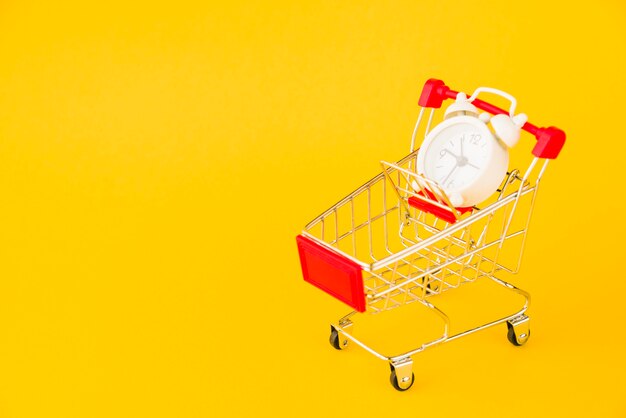 Shopping trolley with little alarm clock 