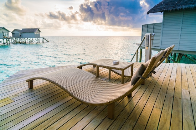 Free photo shore sea water sun deckchair